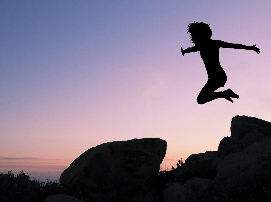 Living Life to The Fullest. Why You Need To! A person jumps through the air, only their silhouette is shown. 