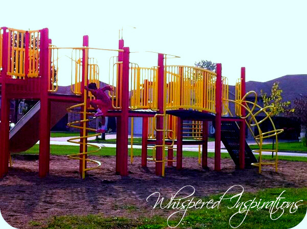 A little girl plays in the jungle gym of a park. This article covers mama guilt that every mom experiences. 