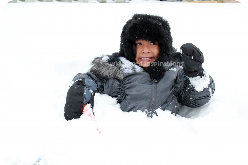 Snowmageddon. A little girl plays in the snow.