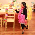 Gabby poses in front of her birthday party table. 