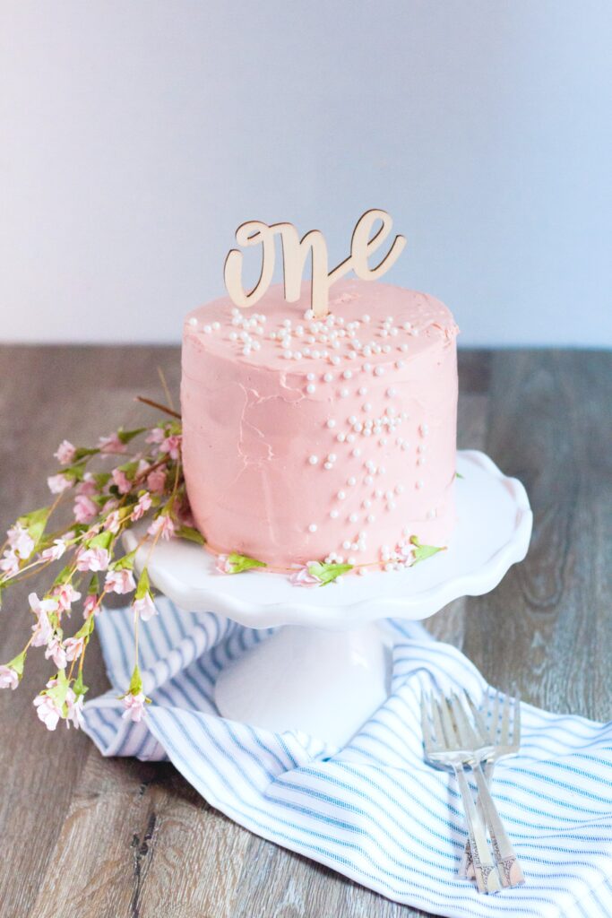 Pink Birthday cake with a one topper.