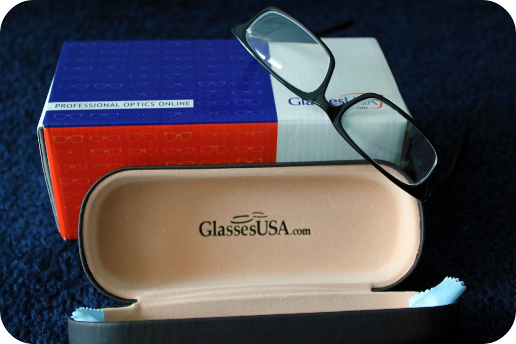 Glasses are displayed on top of a box. 