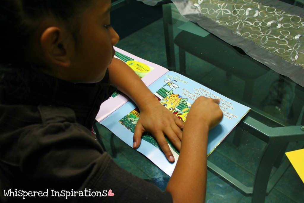 A little girl reads a book. 