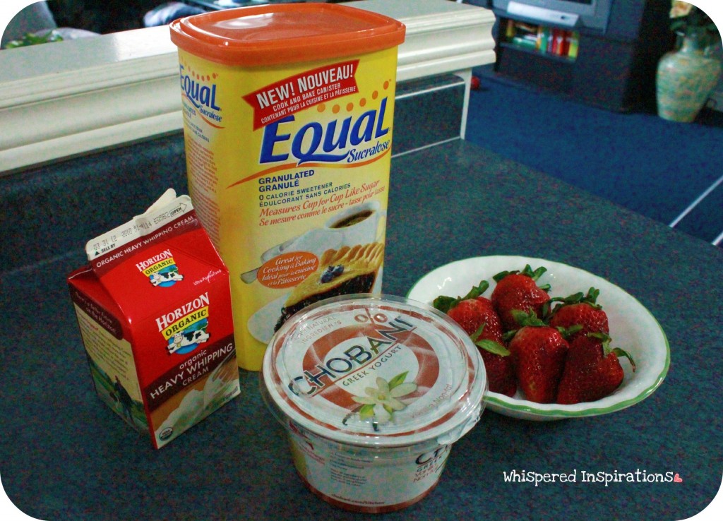 A tub of Equal, cream, yogurt and strawberries. 