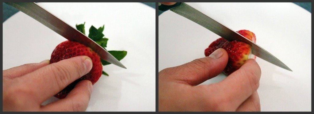 Cutting strawberries for recipe.