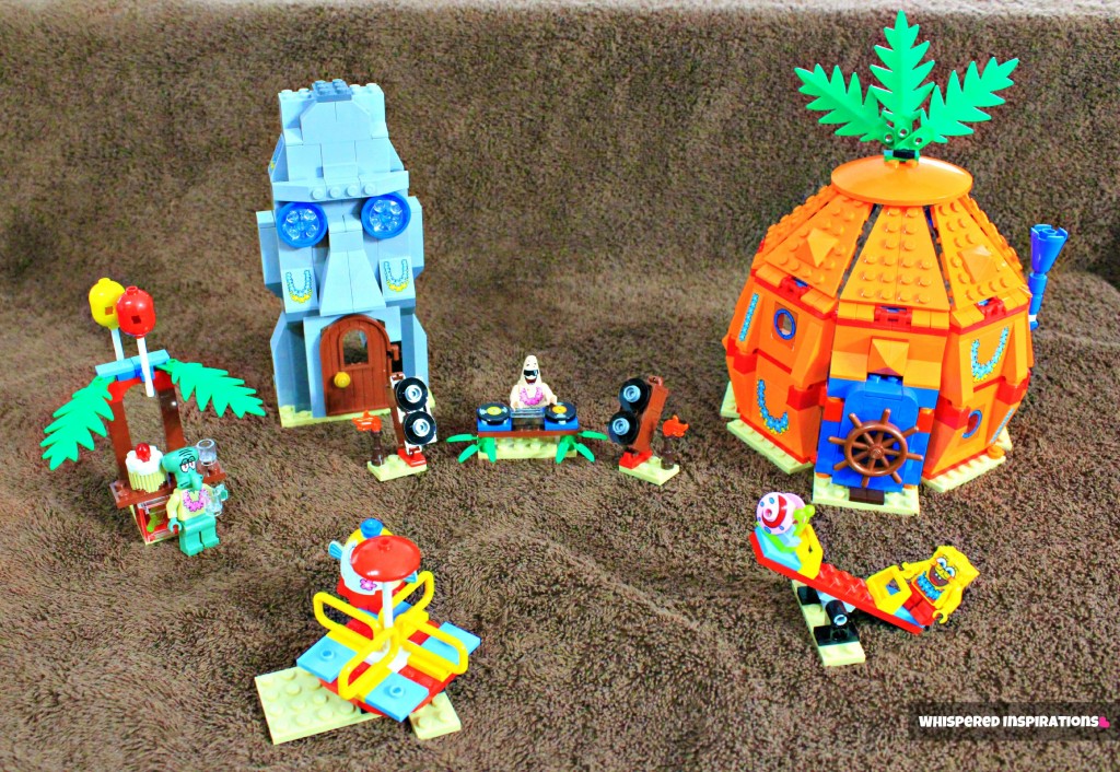 The whole set from the LEGO Spongebob set on a brown towel that looks like sand. 