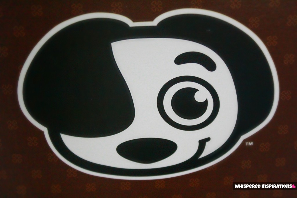 The Shrunks logo, which is a dog covering one eye with his ear.