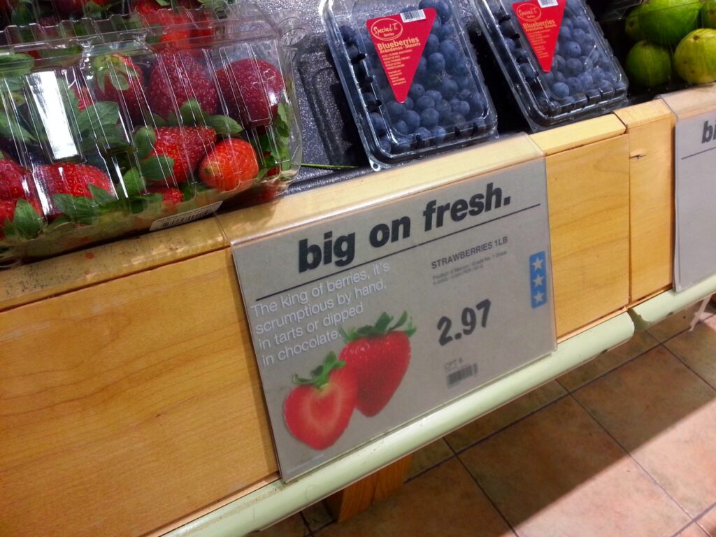 The Real Canadian Superstore Loblaws sign showing $2.97 for strawberries. 