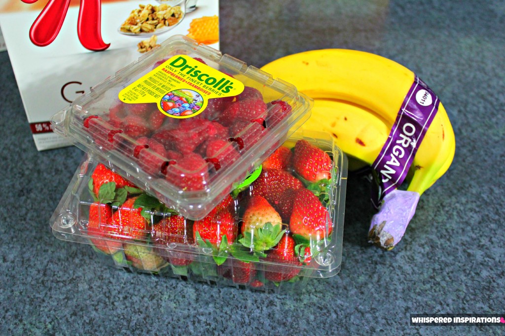 Strawberries, granola, bananas, and raspberries. 