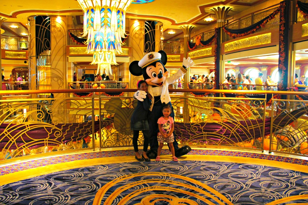 The girls pose with Captain Mickey. 