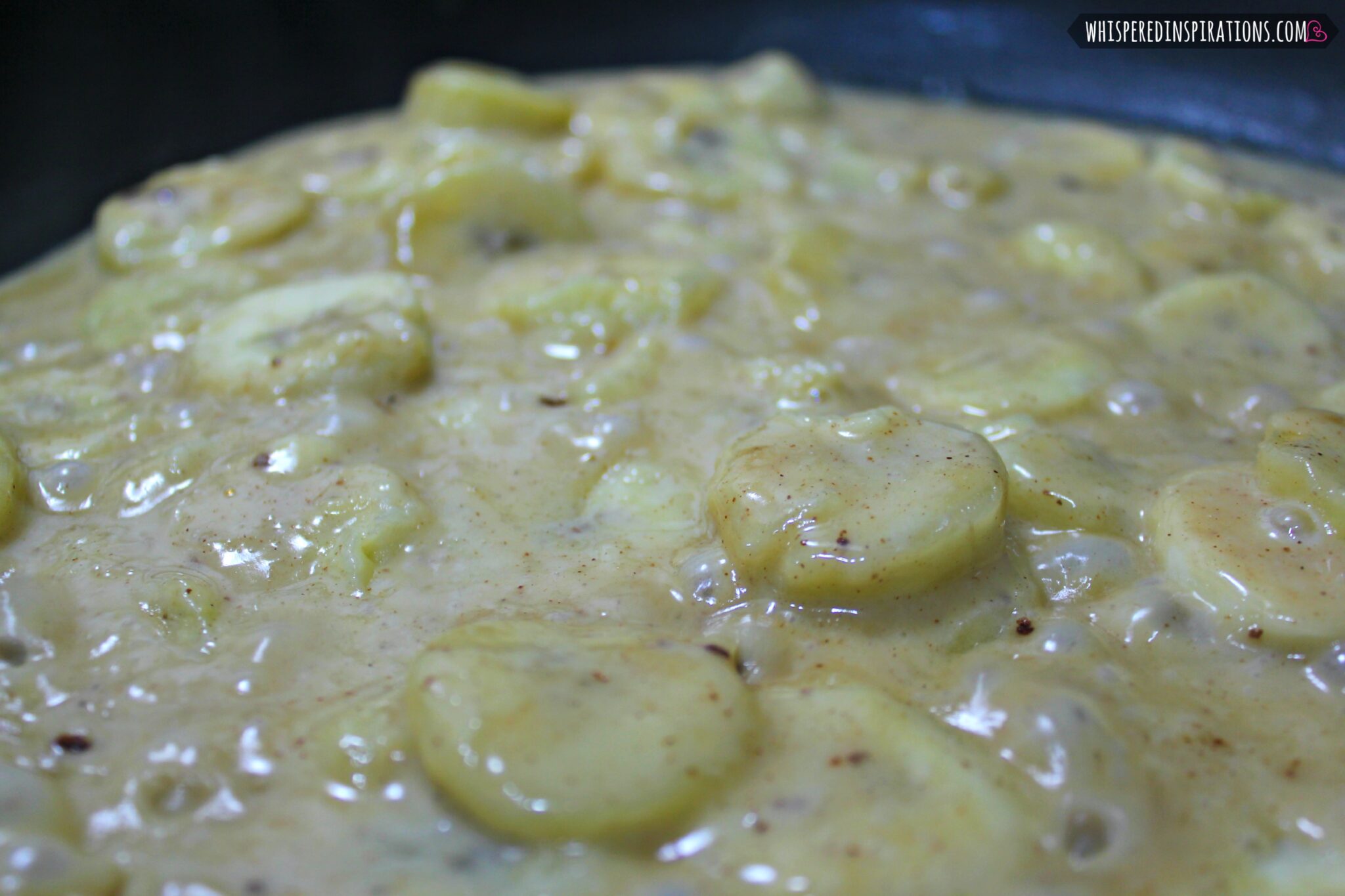 The banana foster filling being reduced in a pan.