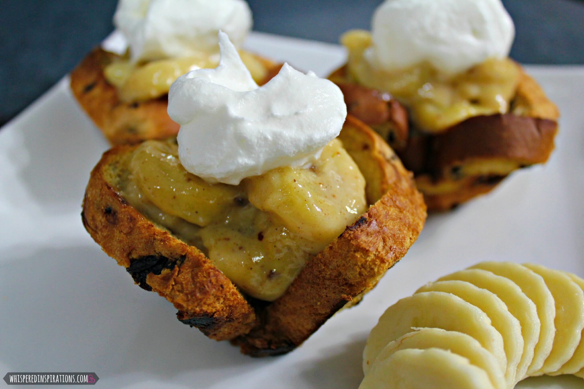 Banana foster filling inside a cinnamon raisin bread cup.