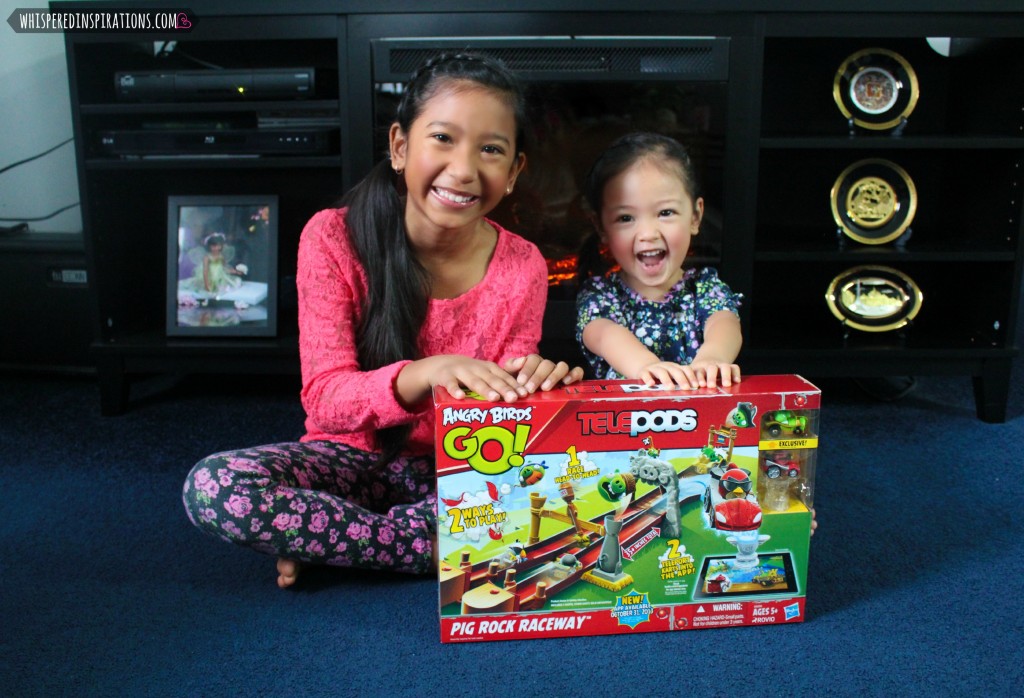 Two little girls are excited to open their new Angry Birds TELEPODS.