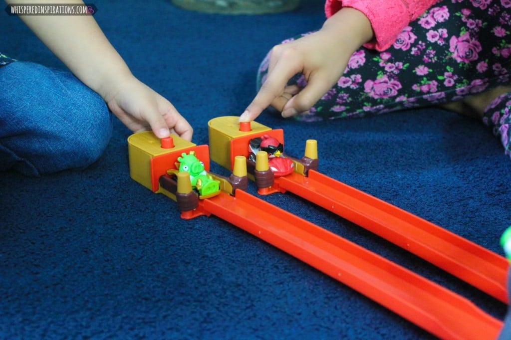 Two little girls play with their new TELEPOD set. 