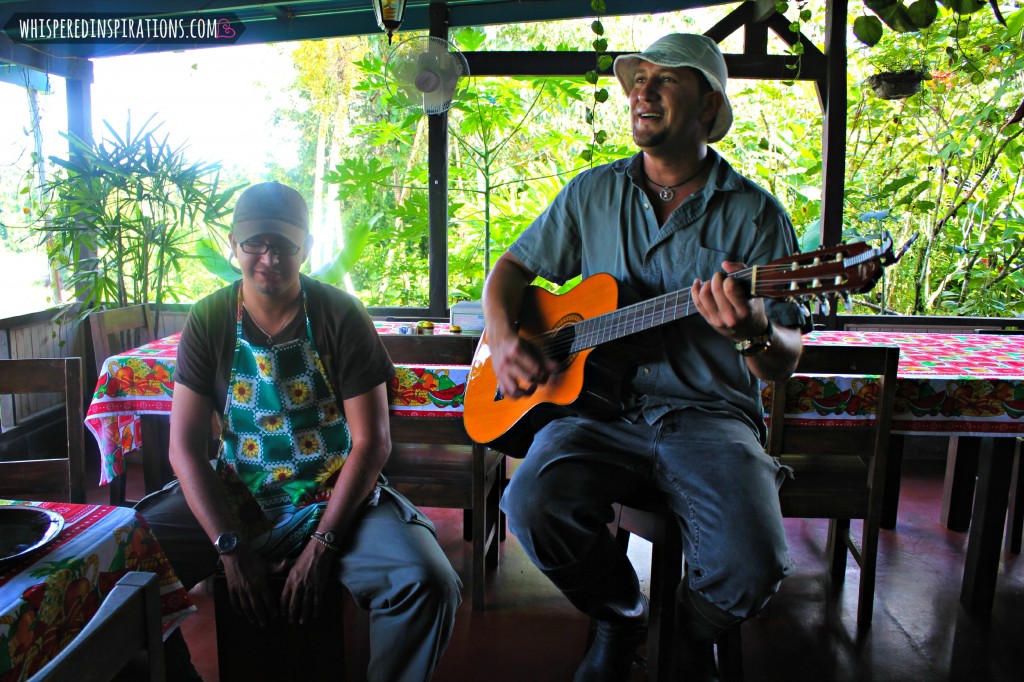 Man playing guitar and singing.