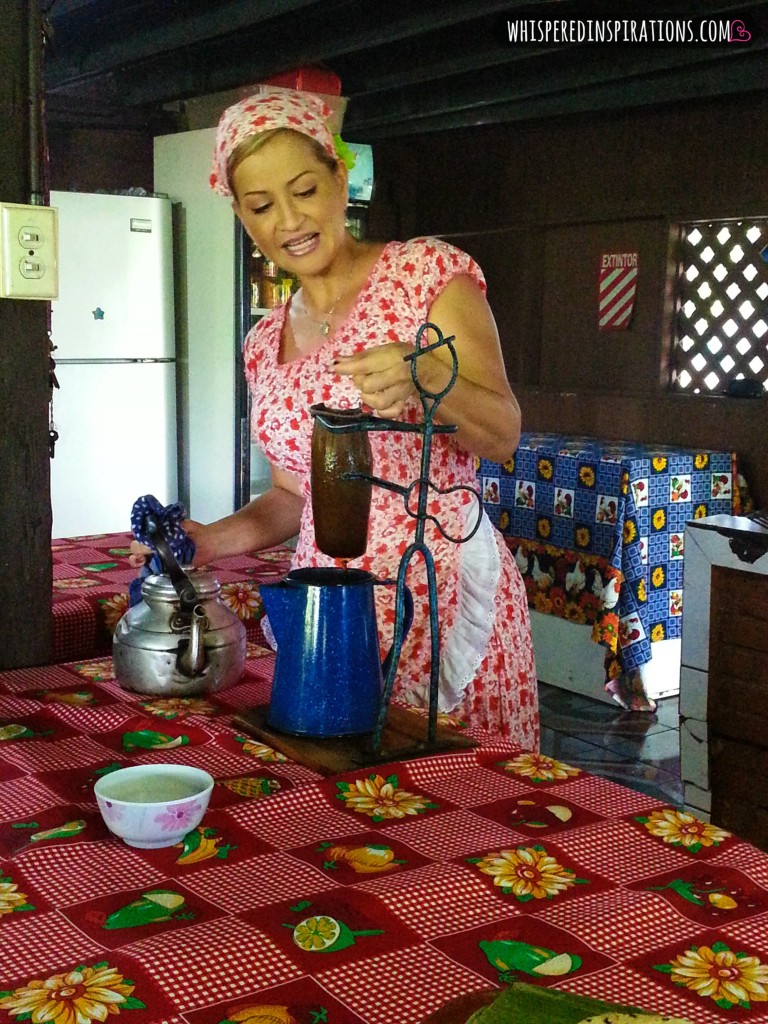 Woman making coffee old-fashioned style, using a coffee press. 