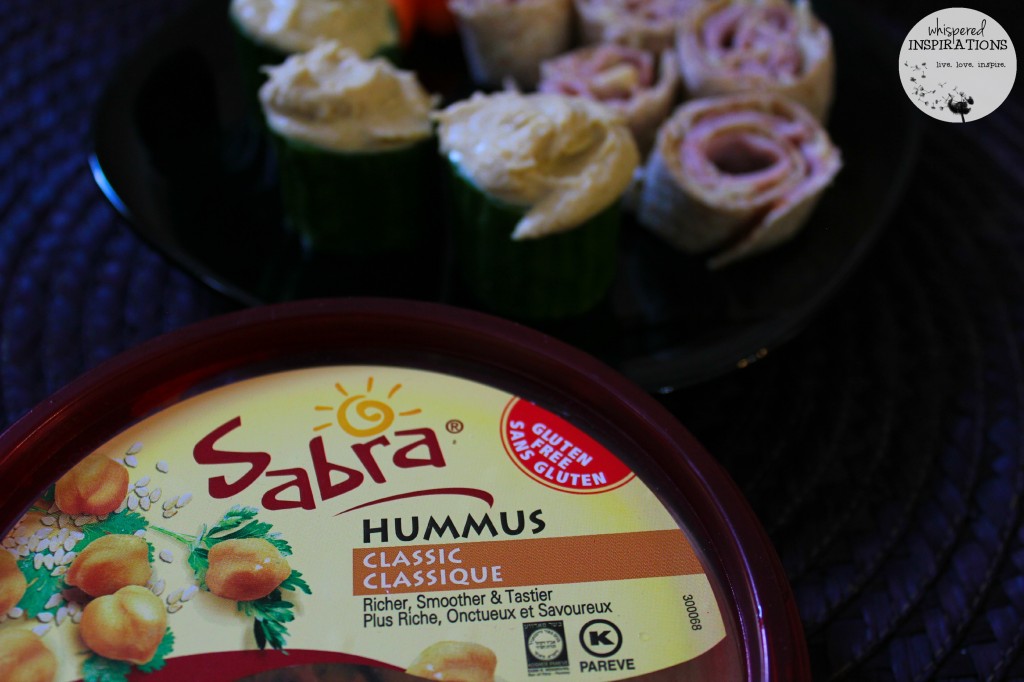 Classic hummus from Sabra is shown. Along with ham, cheese, and hummus pinwheels and cucumber hummus floats.