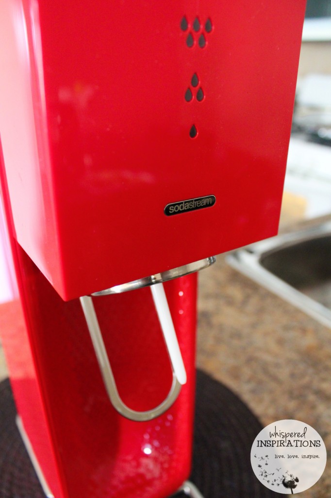 Another shot of a red SodaStream machine. 