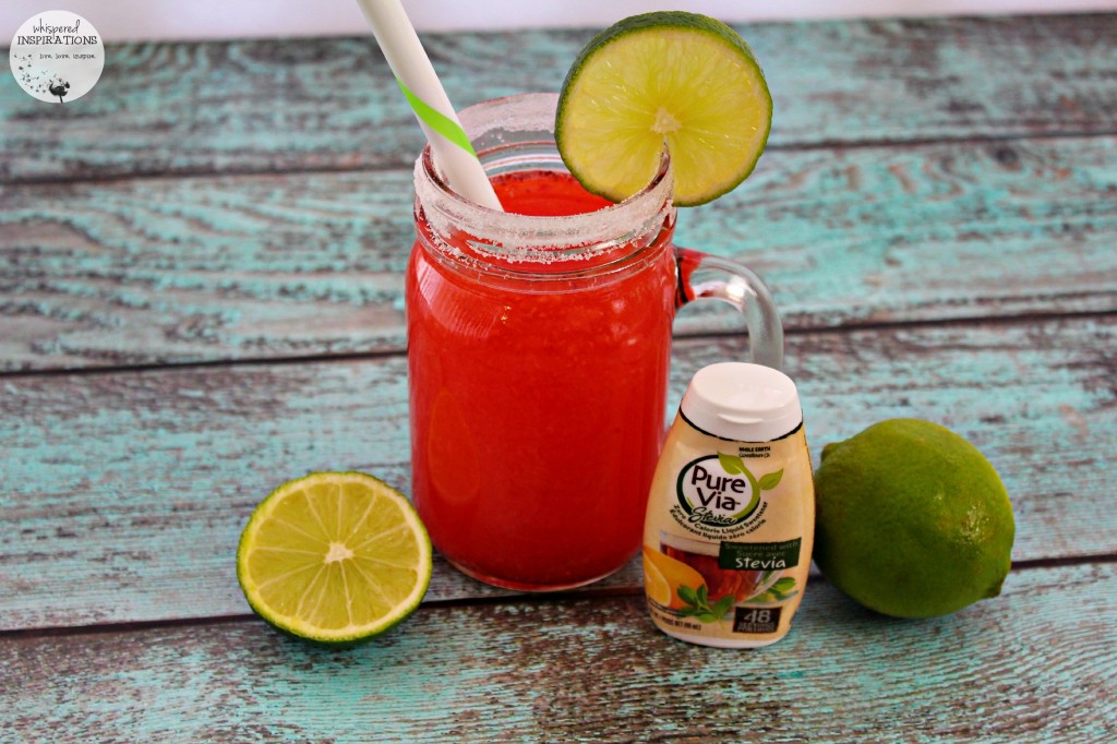 A stevia rimmed glass is filled with Strawberry Limeade and Pure Via Stevia Sweetener.