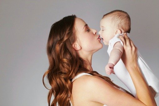 mom-kissing-baby