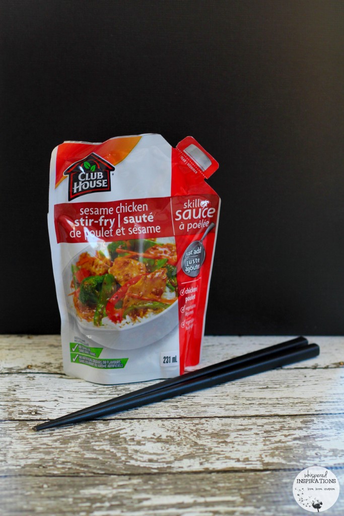 A pair of chopsticks and a Club House Sesame Chicken Stir-Fry skillet sauce is shown. 