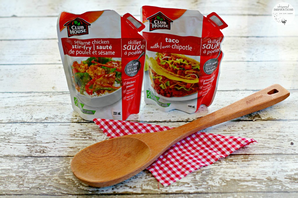 Club House skillet sauces with a wooden spoon are shown. 