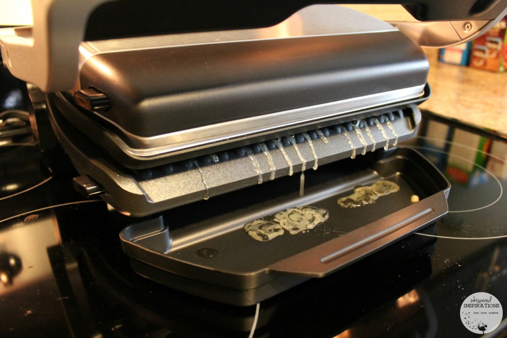 T-fal Optigrill being used and dripping fat onto tray. 