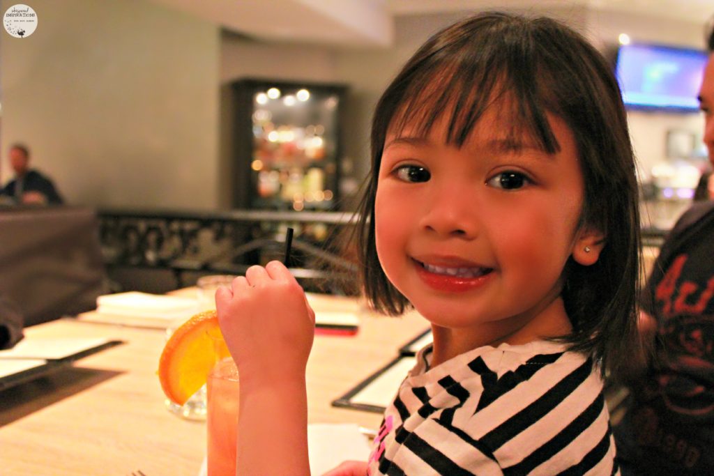 Mimi enjoying a Shirly Temple at Citrus Restaurant.