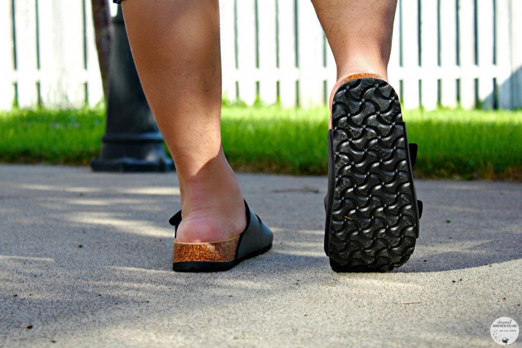 Darasak walks around the backyard with his Viking sandals.