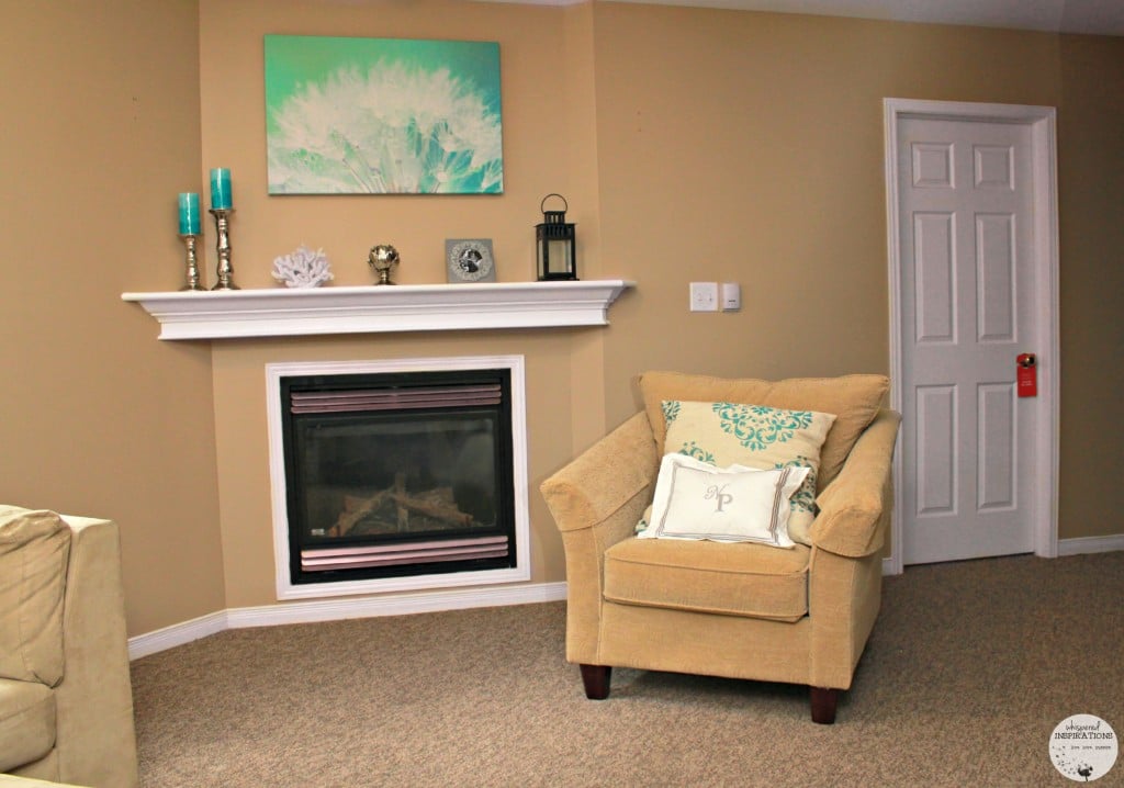 Fireplace with mantle and a share next to it.