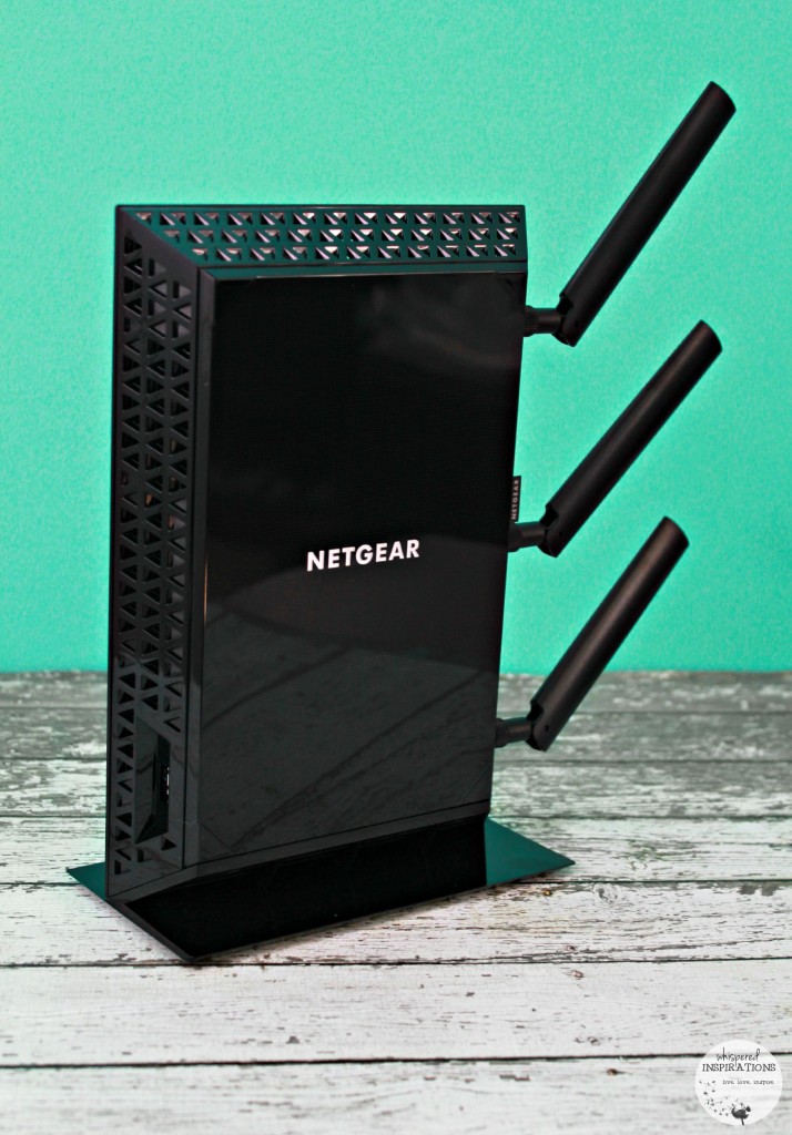 Nighthawk WiFi Range Extender stands against a teal background.
