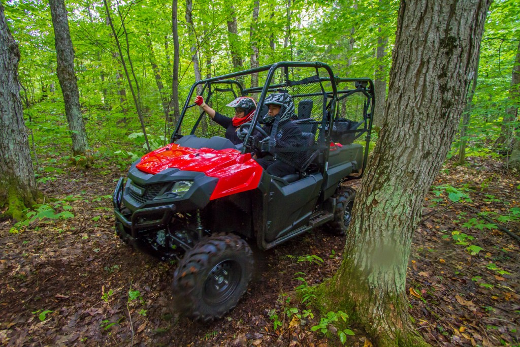 Riding a Honda side-by-side through the Muskoka Woods.