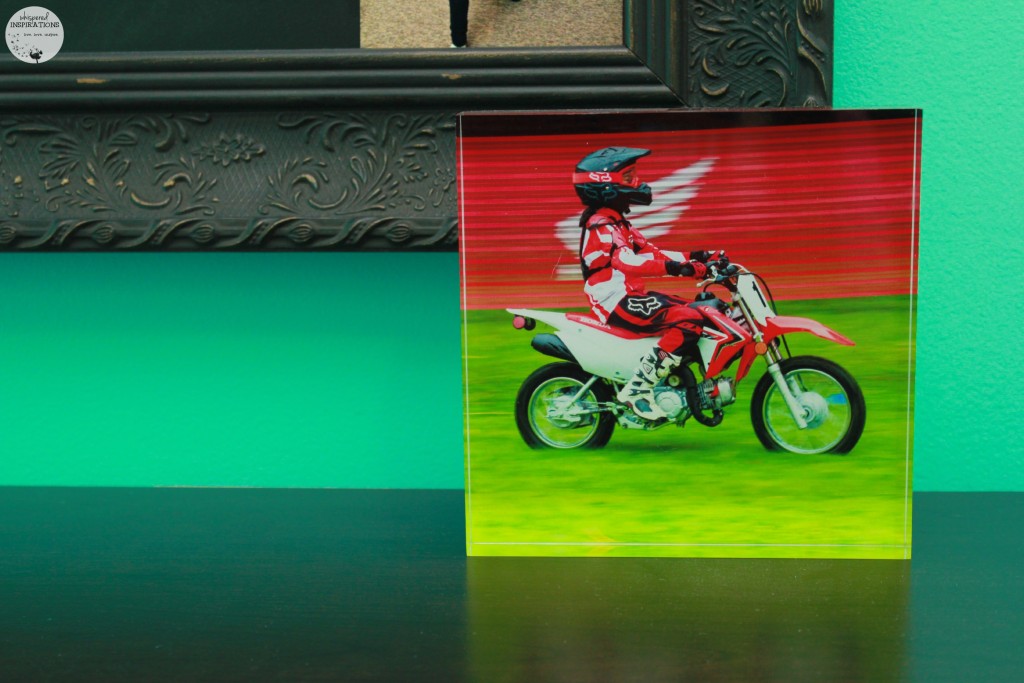 An acrylic block of Gabby riding on a Honda dirt bike. 