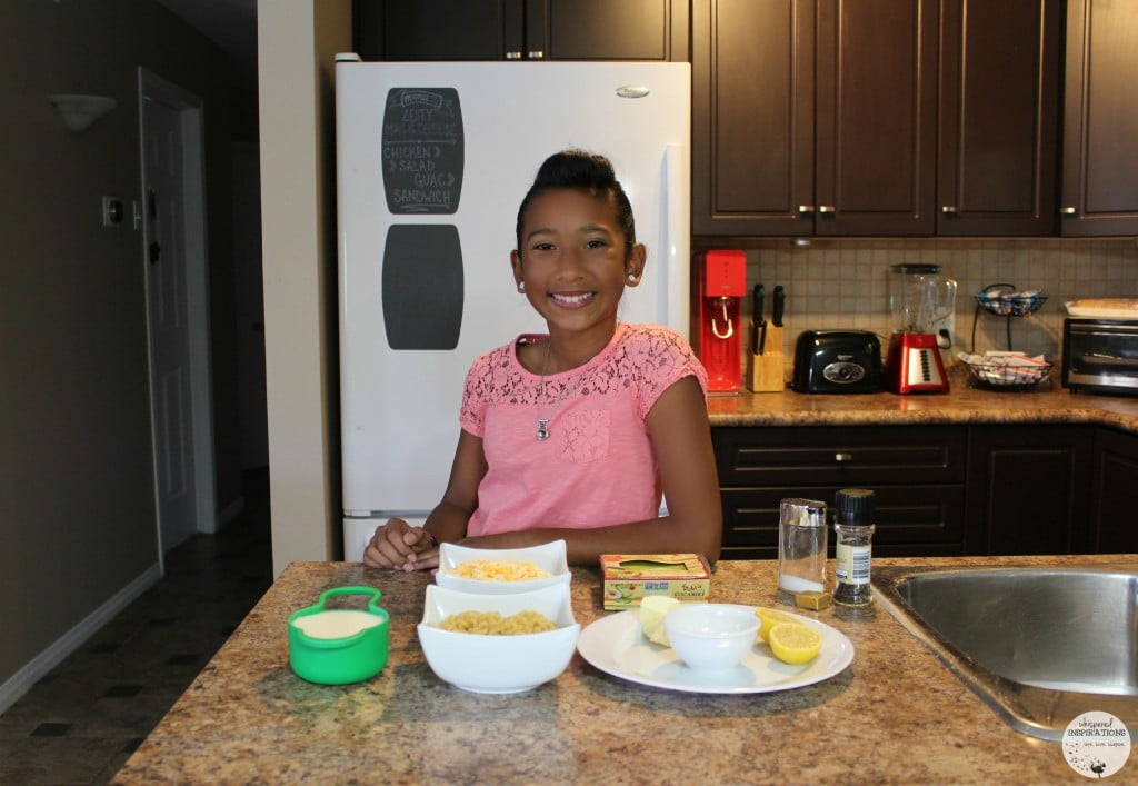 Gabby getting read to cook with Sabra and is making Guacamole Macaroni and Cheese.