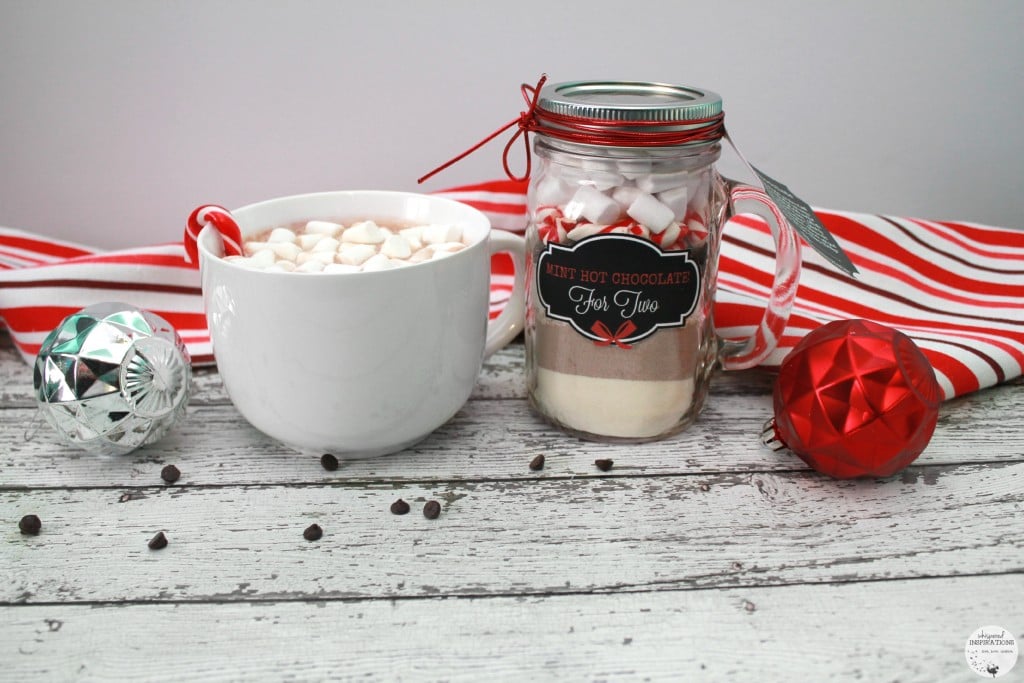 Mint Hot Chocolate is prepared into a huge mug and the homemade gift in a mason jar with a label.