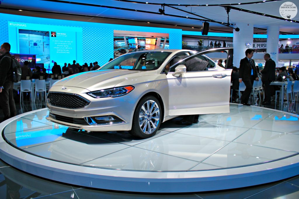 A silver 2017 Ford Fusion sits on display at NAIAS.