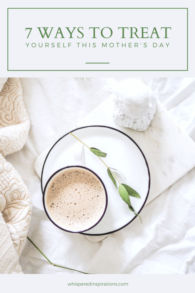 Bed with latte and plate, white sheets, and a blanket. A banner above reads, "7 Ways to Treat Yourself During Mother's Day."