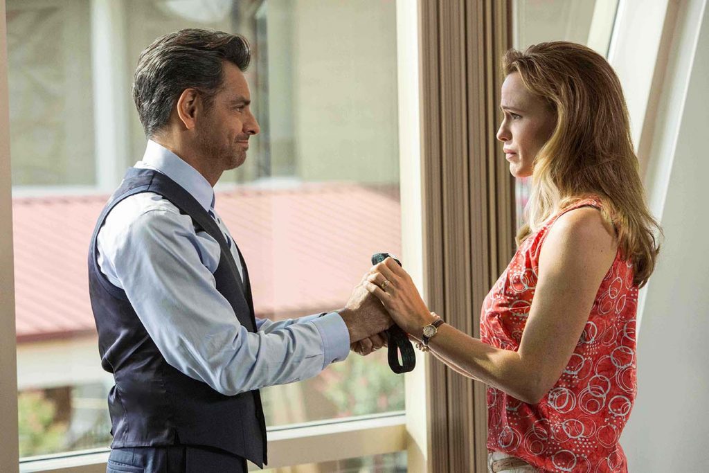 Dr. Nurko (EUGENIO DERBEZ) hands his Elmo tie to Christy (JENNIFER GARNER) as a memento now that Anna seems to be healed in Columbia Pictures' MIRACLES FROM HEAVEN.