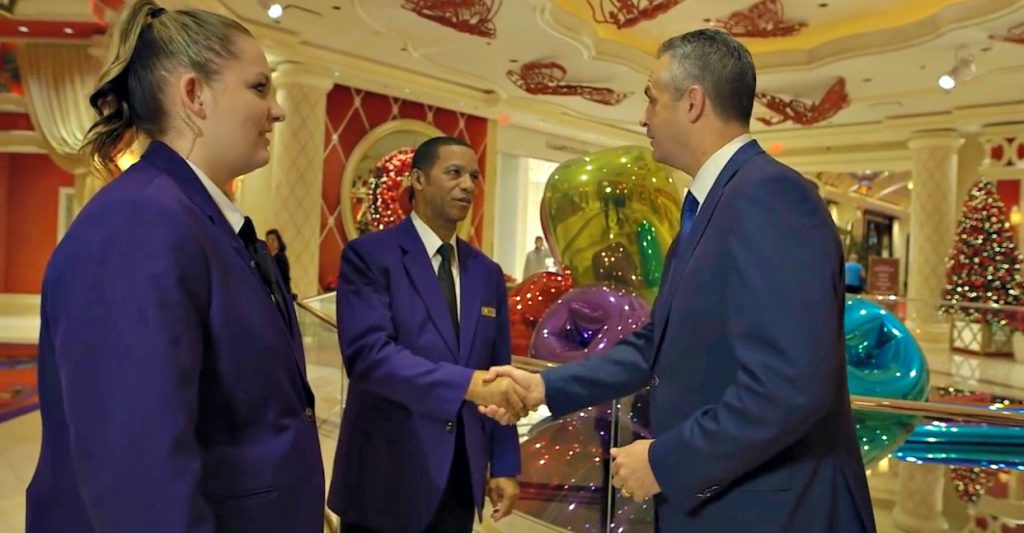 Troy, VP of Security at the Wynn, shakes hands with his employees. 