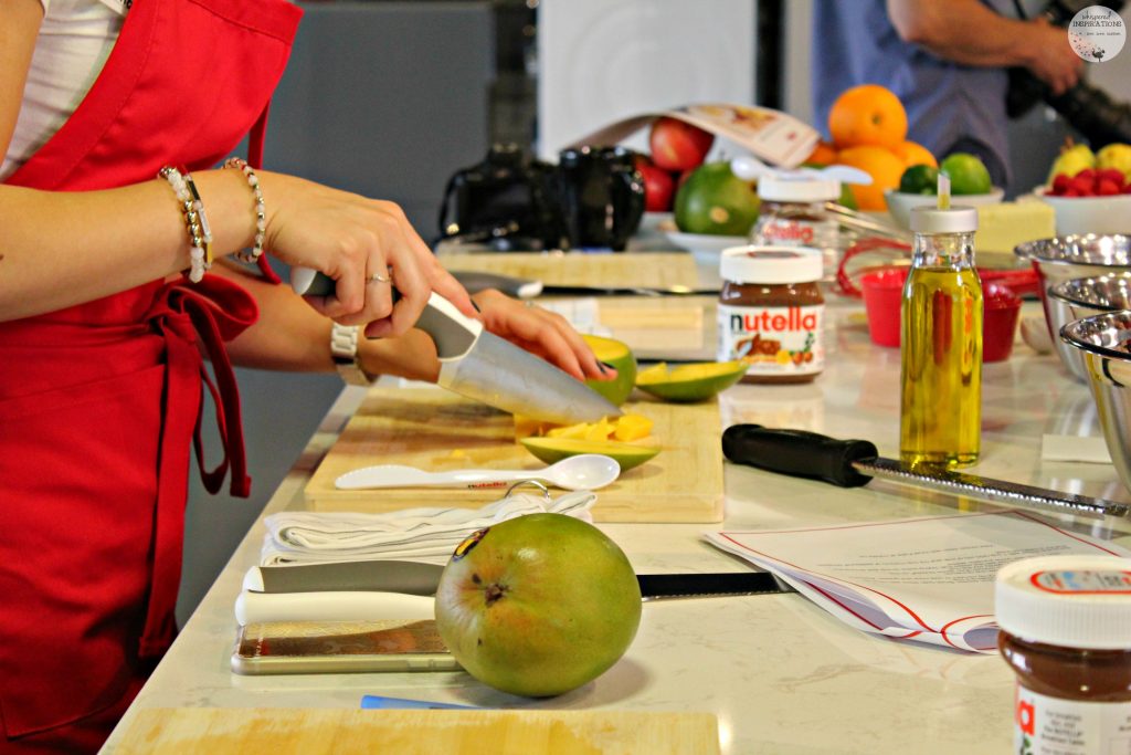 Cutting mango and working in the Nutella kitchen making recipes. 