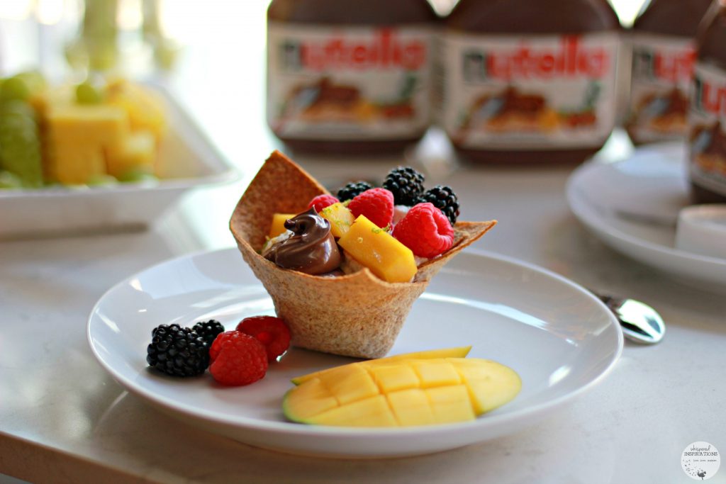 Tortilla bowl filled with Nutella, fruits, and more. 