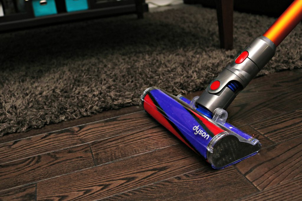 The Dyson V8 Absolute attachment on hardwood flowers. 