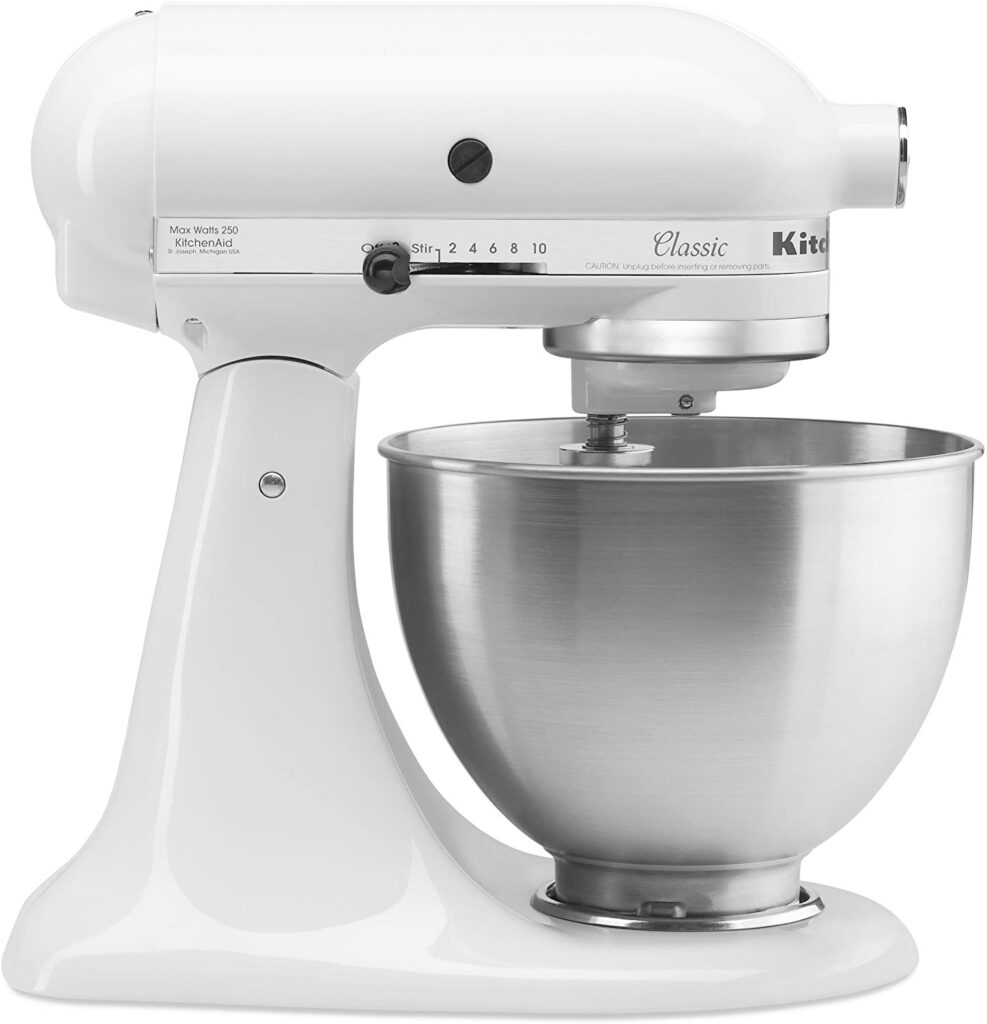 A white Kitchen Aid Stand Mixer with bowl. 