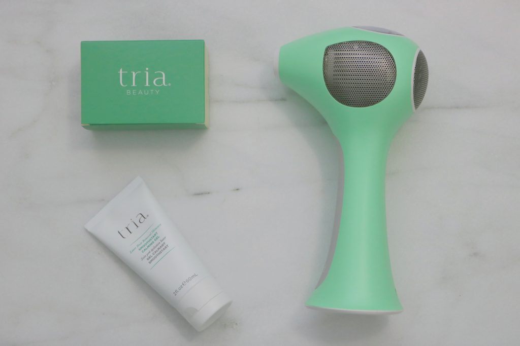 Tria hair removal tool and Tria gel flay lay.