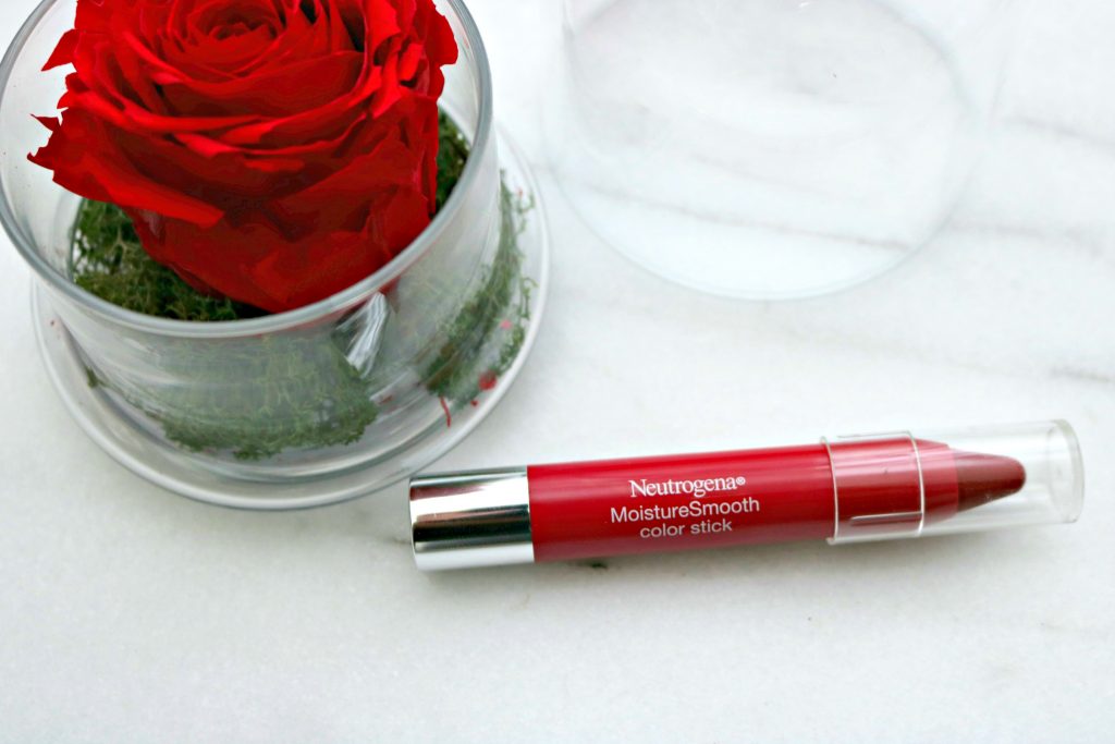 A rose in a glass jar and Neutrogena Moisture Smooth Color Slick.