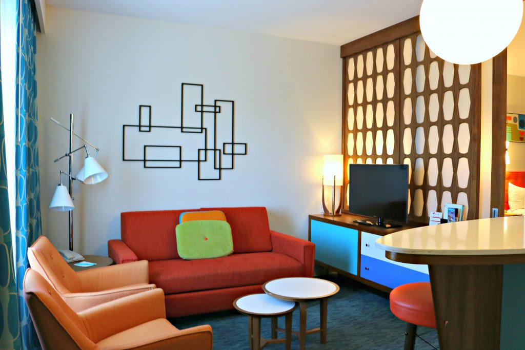 The living room area with a pull out couch in the family suite at Cabana Bay Beach Resort. 