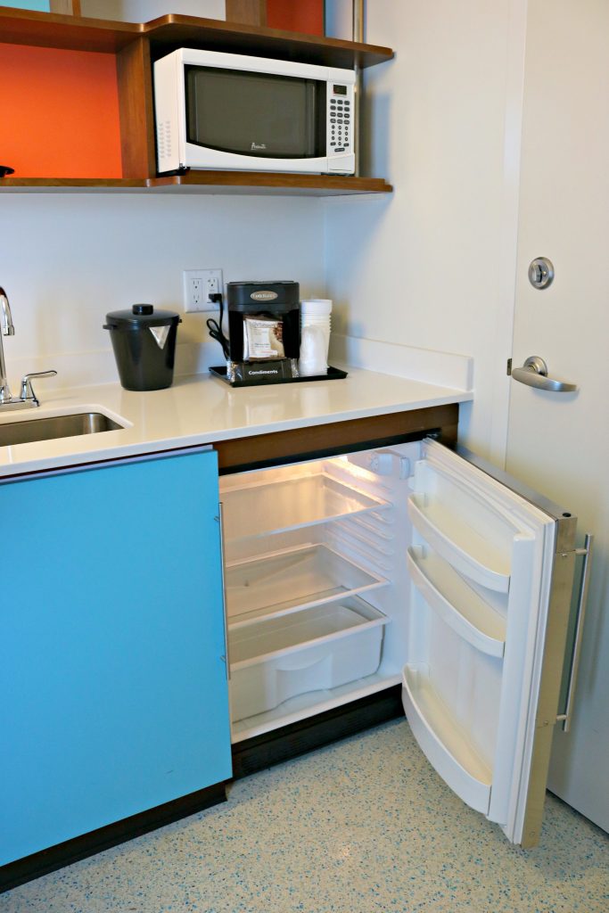 The kitchenette with a microwave, mini fridge, and coffee maker. 