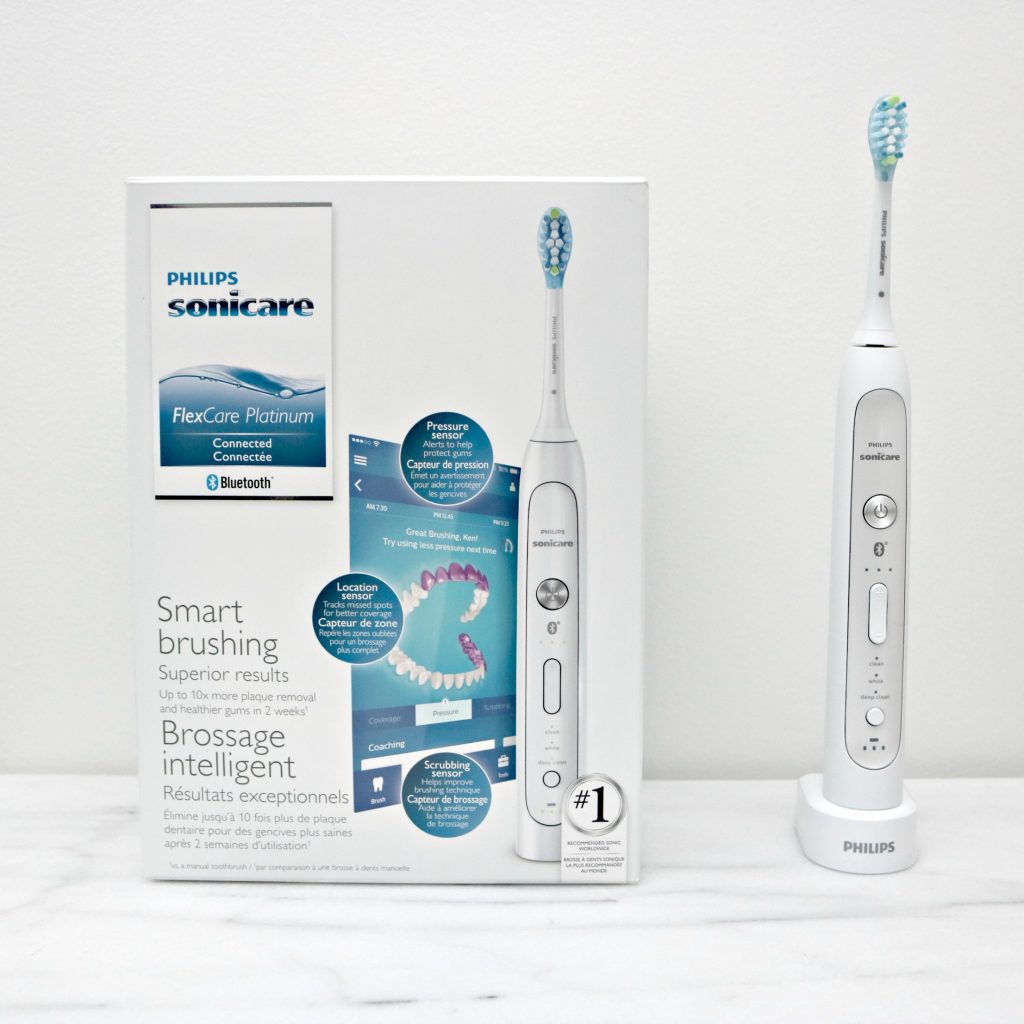 A Philips Sonicare Toothbrush box with brush next to it. 