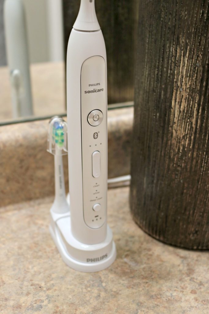 A close up of the Sonicare toothbrush with an extra head. Truly smart brushing with Philips.