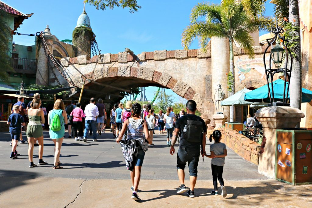 A dad and his two girls walk into Island of Adventure. 